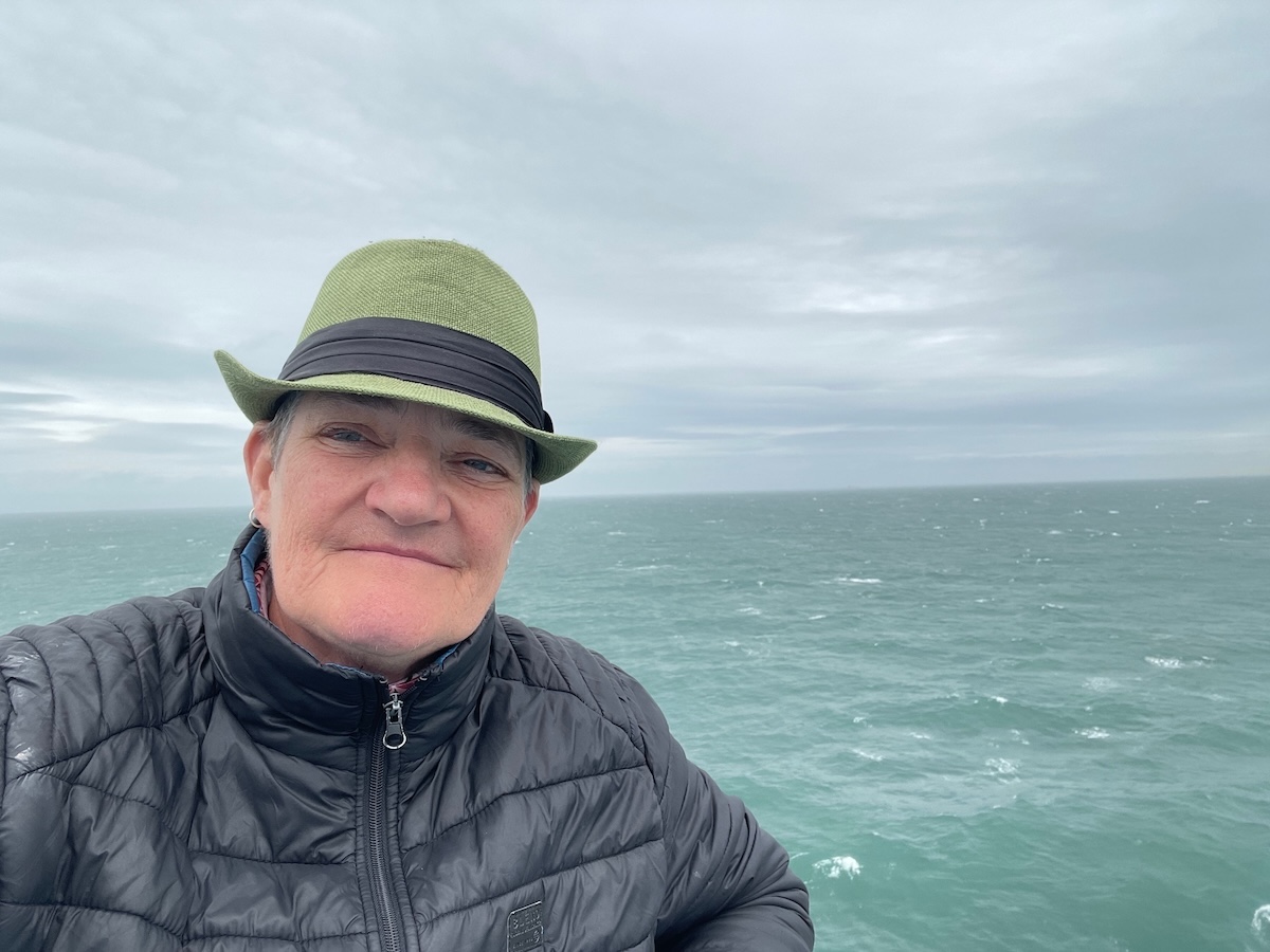 Al on the ferry with sea in th ebackground