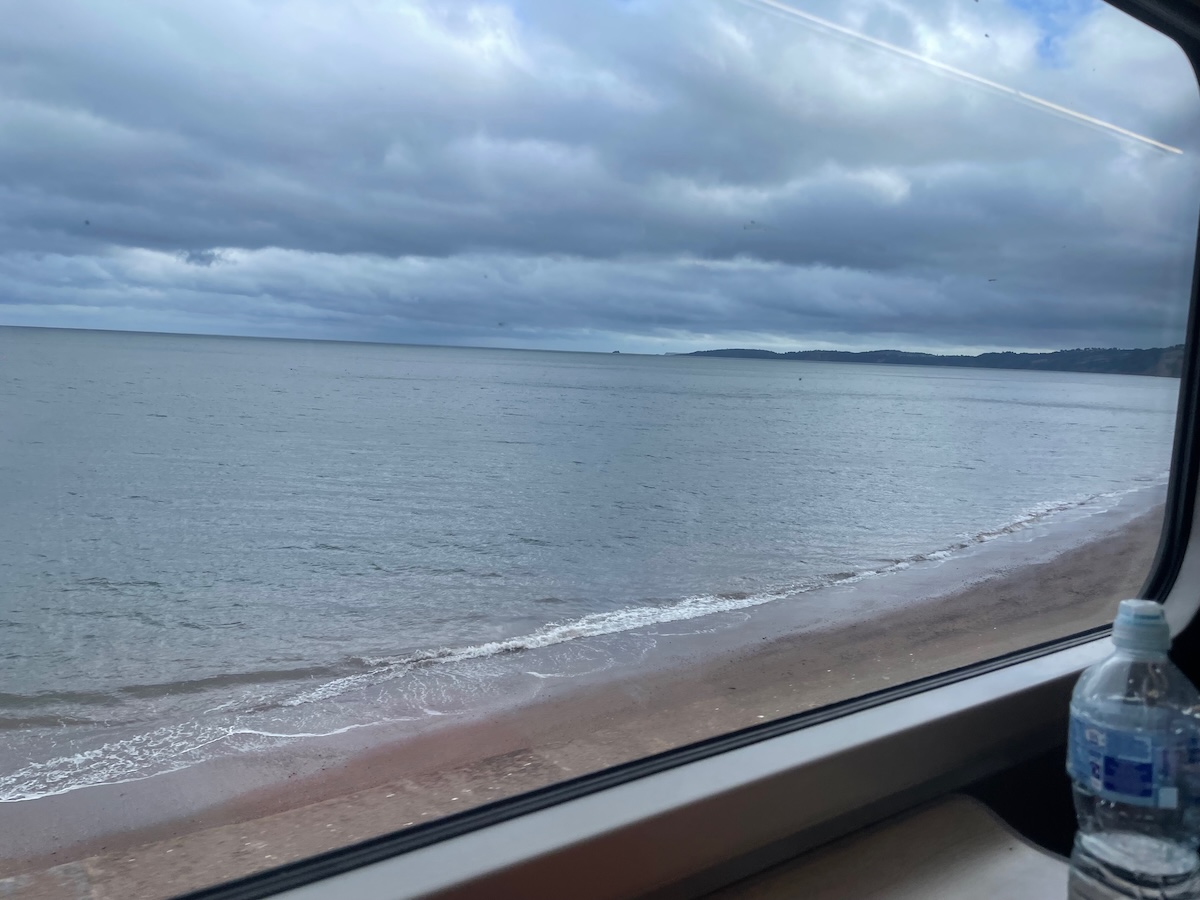 train tracks and view of the sea from the train in Cornwall