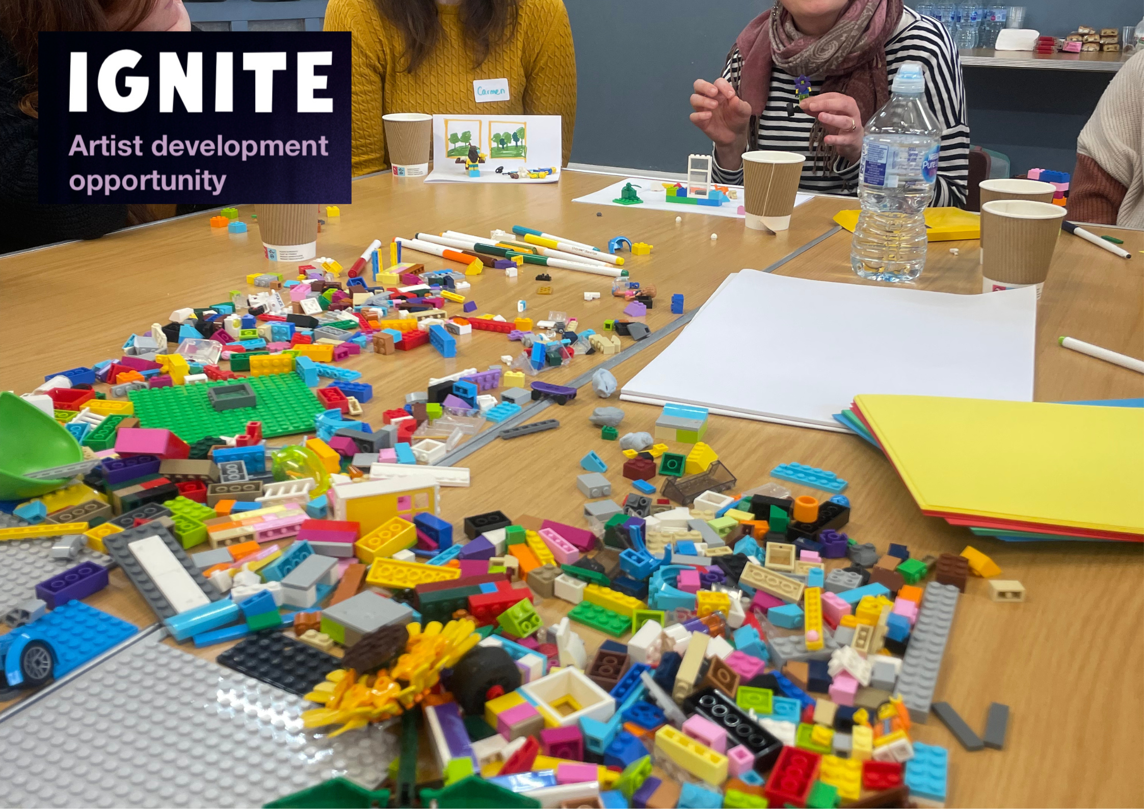 Workshop activity including pens, papers and lego