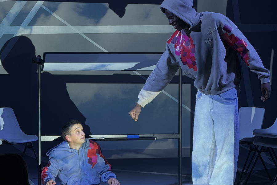 Tobias (Tye) offers a fist bump to zanni CT (Bailey)
